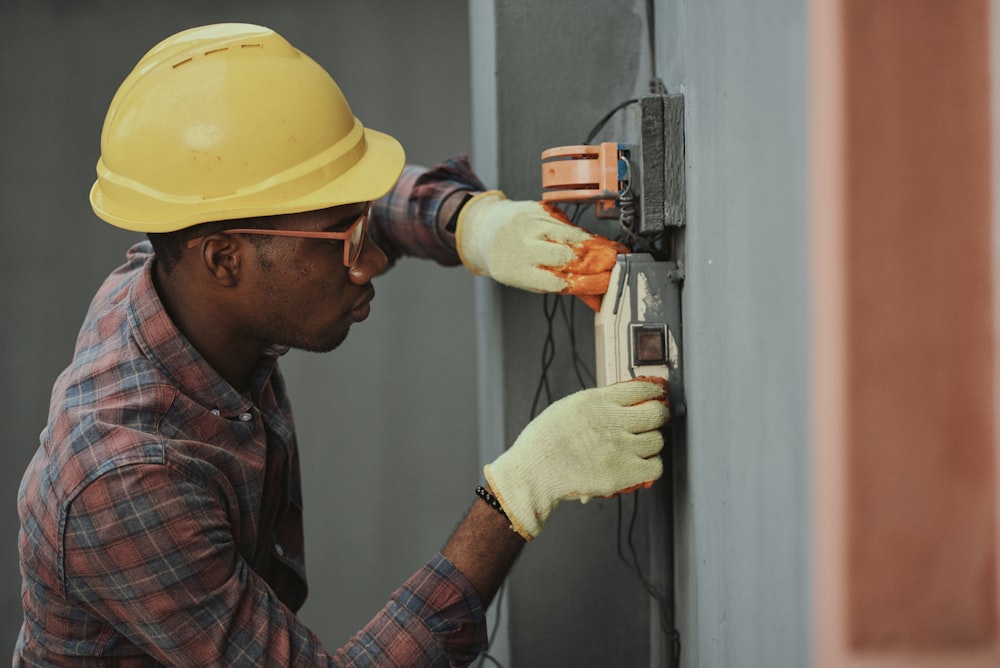Technician performing electrical maintenance work